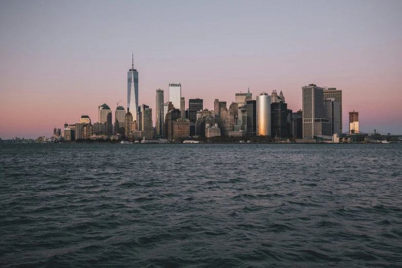 the skyline of the city of manhattan at twilight