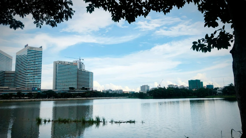 an image of some buildings and the water