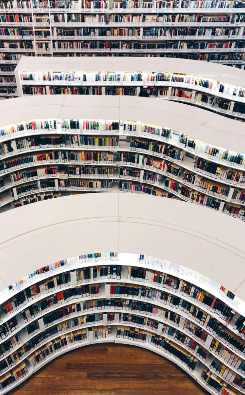 a large group of books on display in a liry