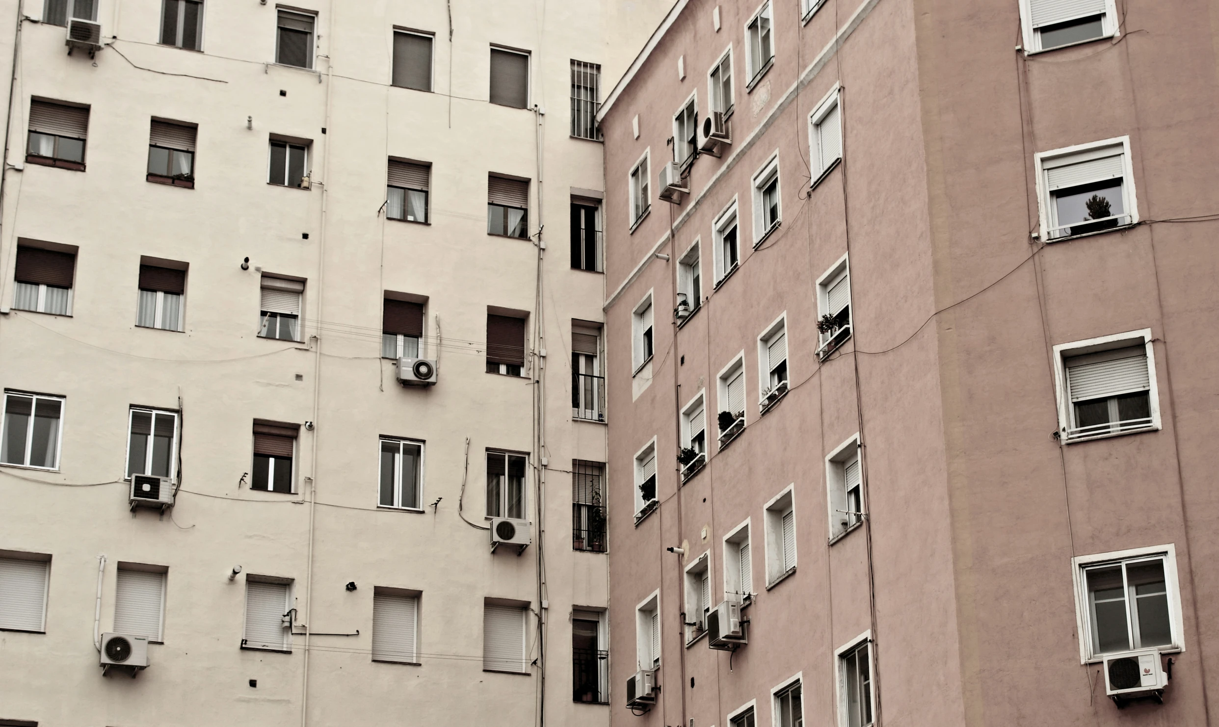 the wall of a building that has been partially cut apart and closed