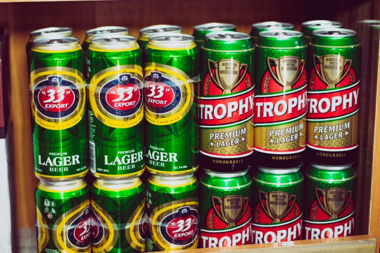six cans of lager in a box on the shelves