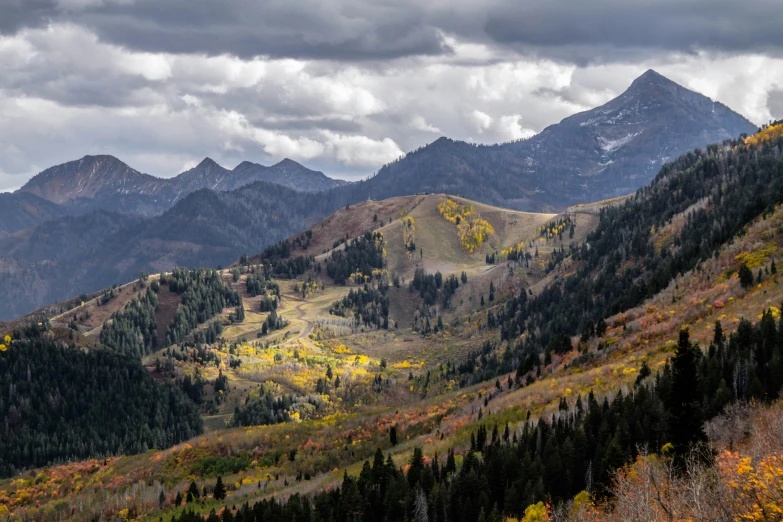 an image of mountains in the fall season