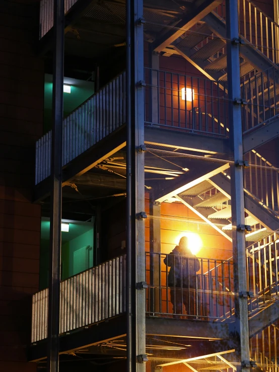 a spiral staircase is seen in the dark