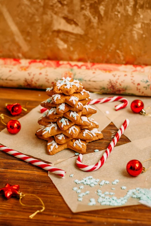 some christmas tree cookies are in the brown paper