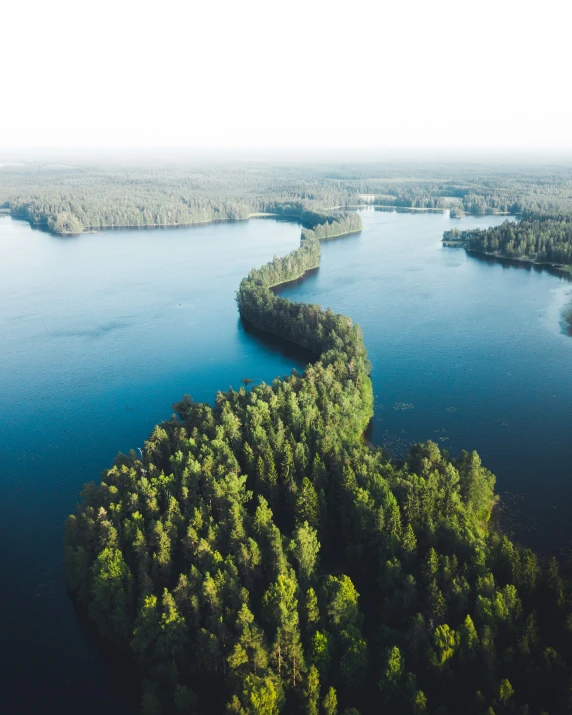 the water is so deep that it looks like it could be surrounded by trees