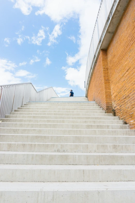 there is a man sitting on some steps