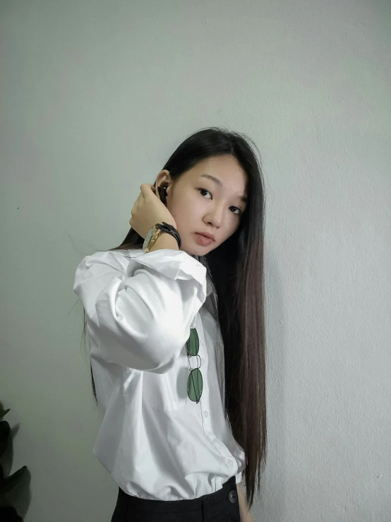 young asian woman with long hair talking on the phone