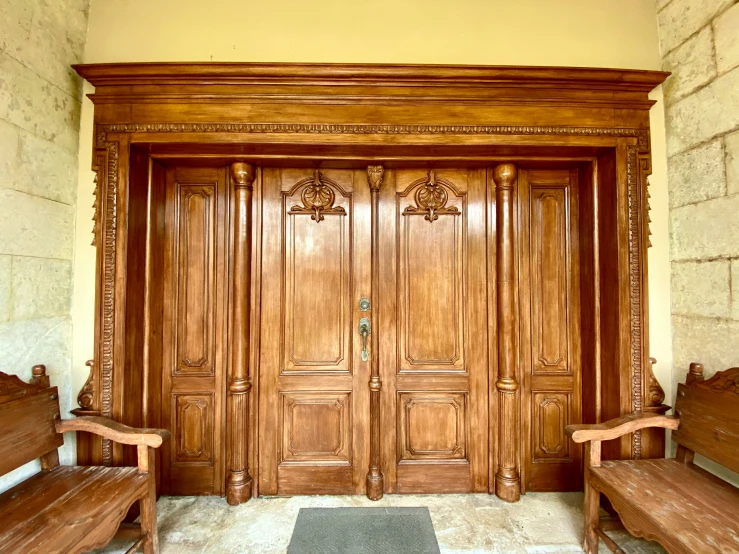 a front door of an old stone and wood building