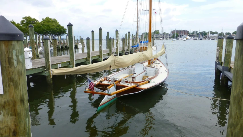 a boat docked at a dock with no roof