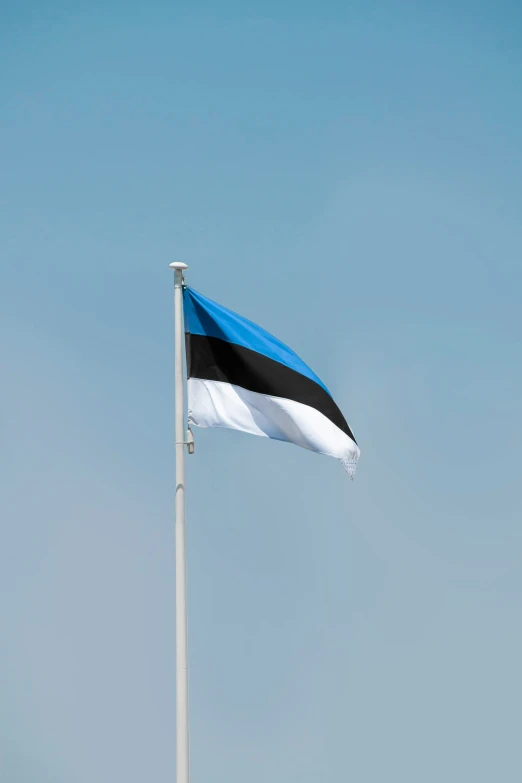 an egyptian flag flies in the wind on a windy day