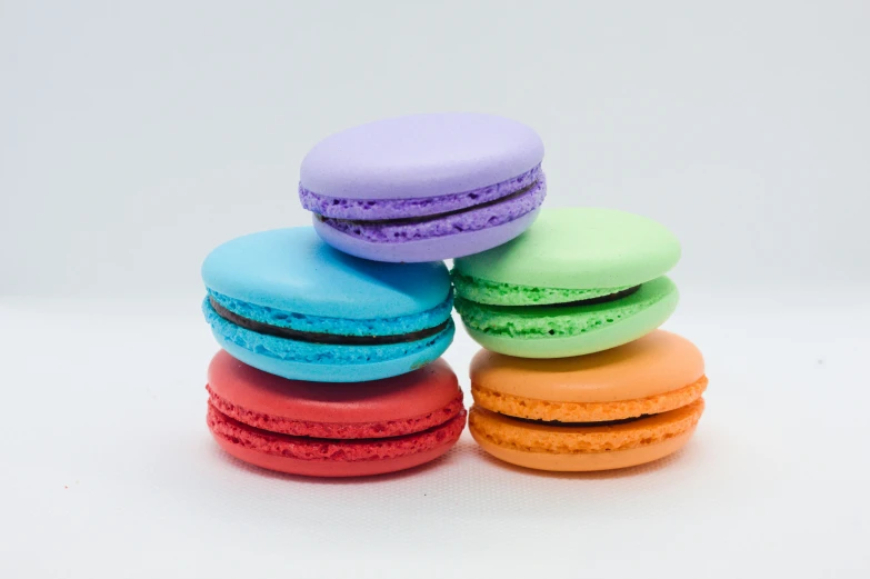 five macaroons that are multi colored