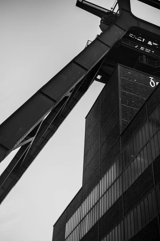 tall building under a partly cloudy sky with sign