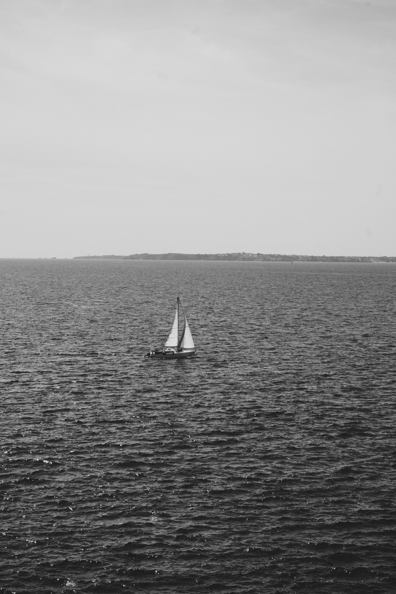 a boat sailing on a large body of water