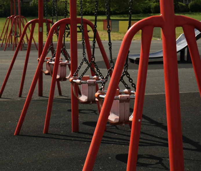 there are many swings on the playground
