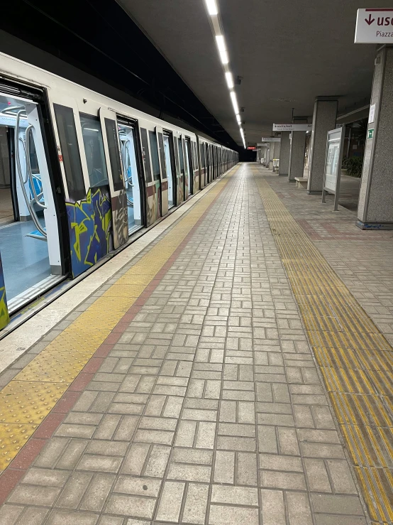 the train station has an almost empty platform