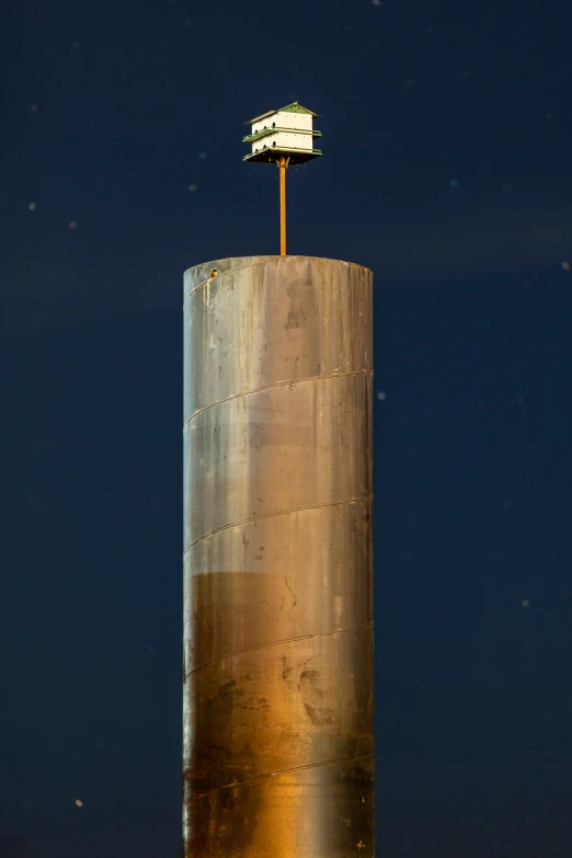 the flag on top of the water tower is visible