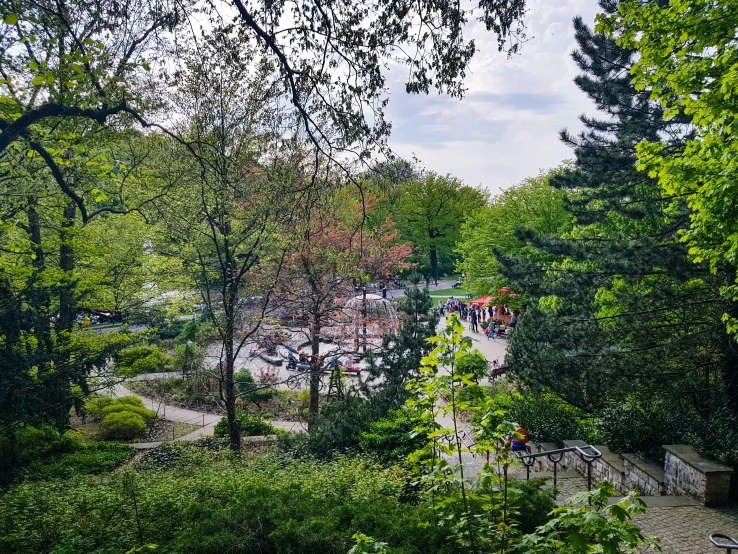 the view down into a park where people are walking