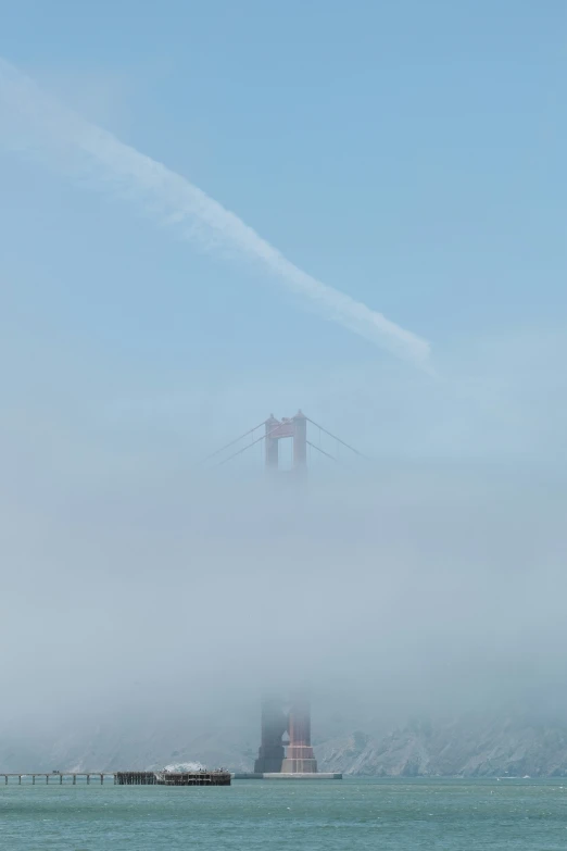 the fog covers a scenic view over the ocean