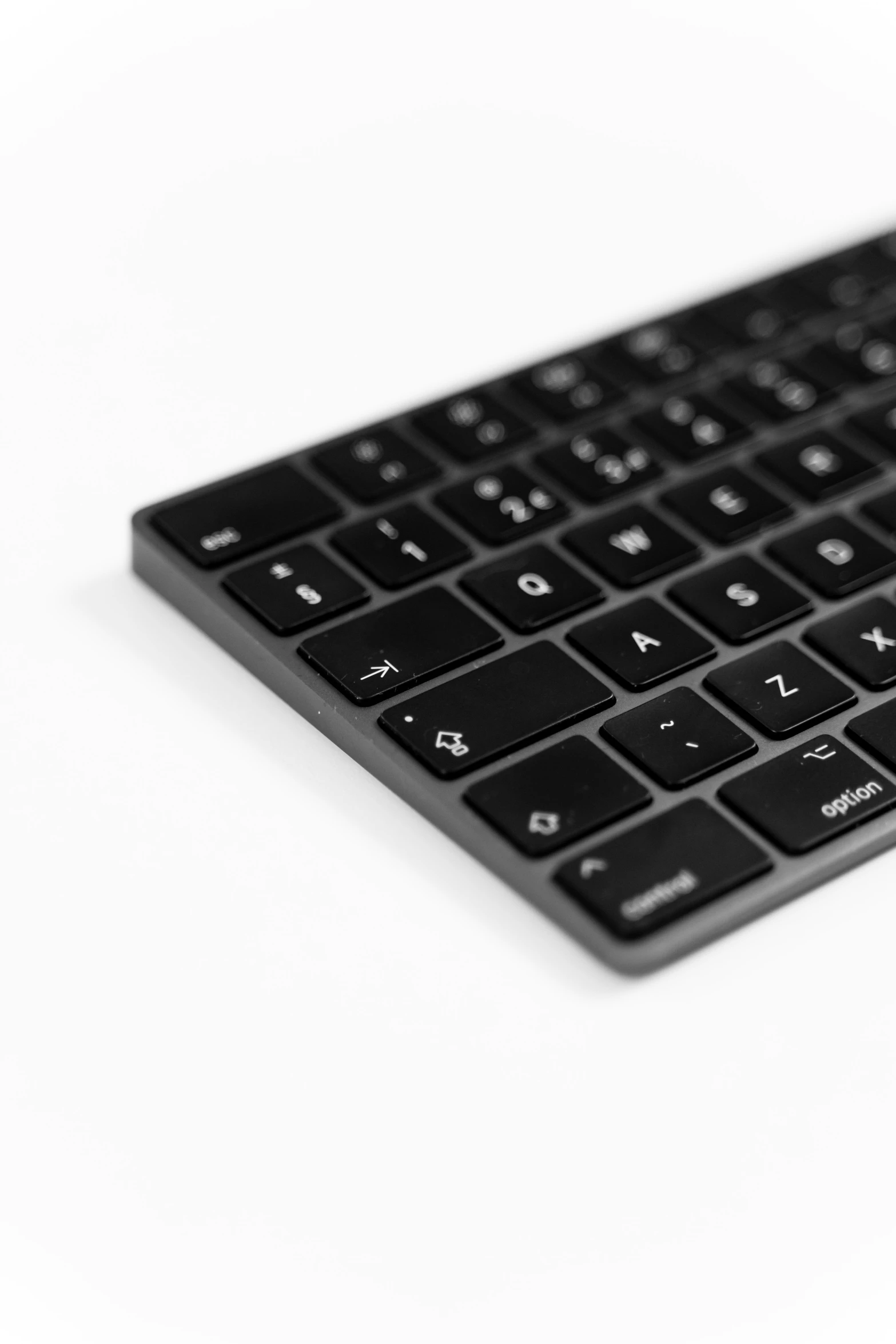 a closeup of a black keyboard with the keys not visible