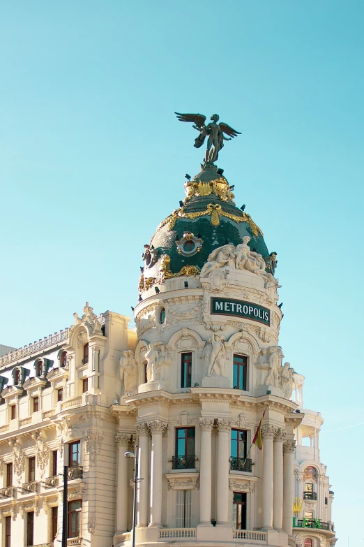 a building with a statue on the top of it