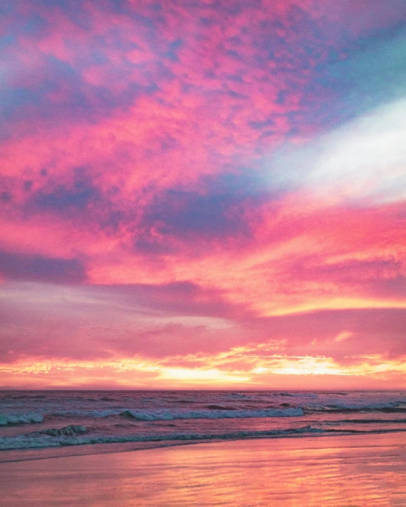 a very beautiful sunset on a sandy beach