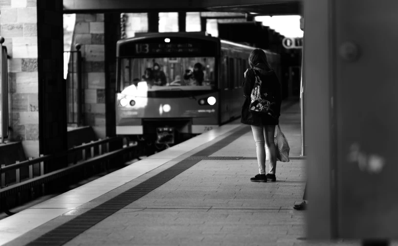 black and white pograph of a subway car passing by