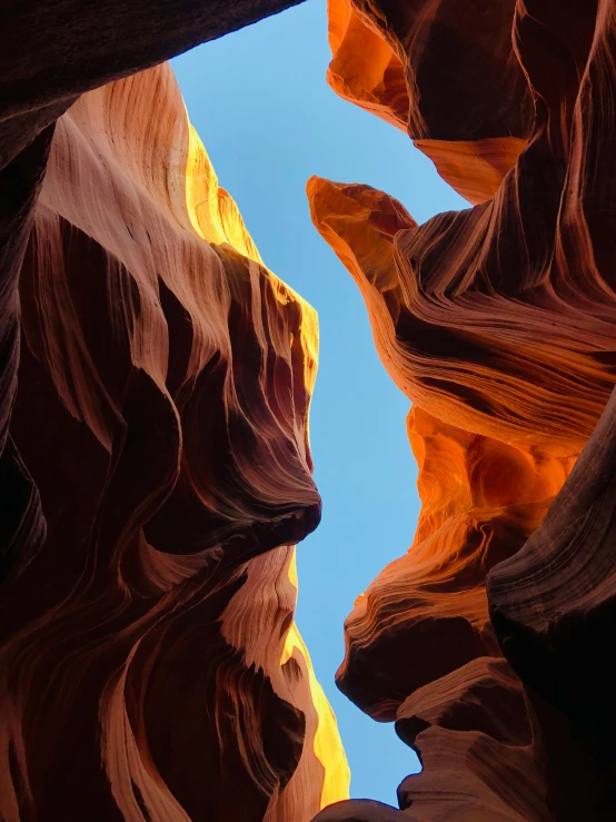 a long narrow canyon between two mountains, with a rock wall in the middle