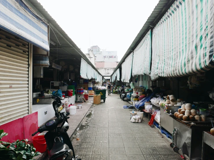 a view of a street filled with store fronts