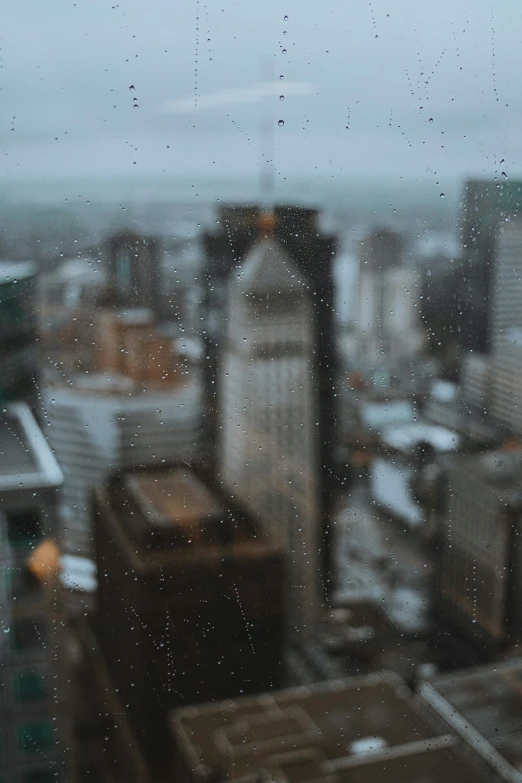 the view out of a window looking at buildings