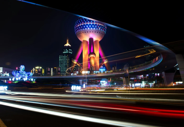 a large tower with a lit up sign