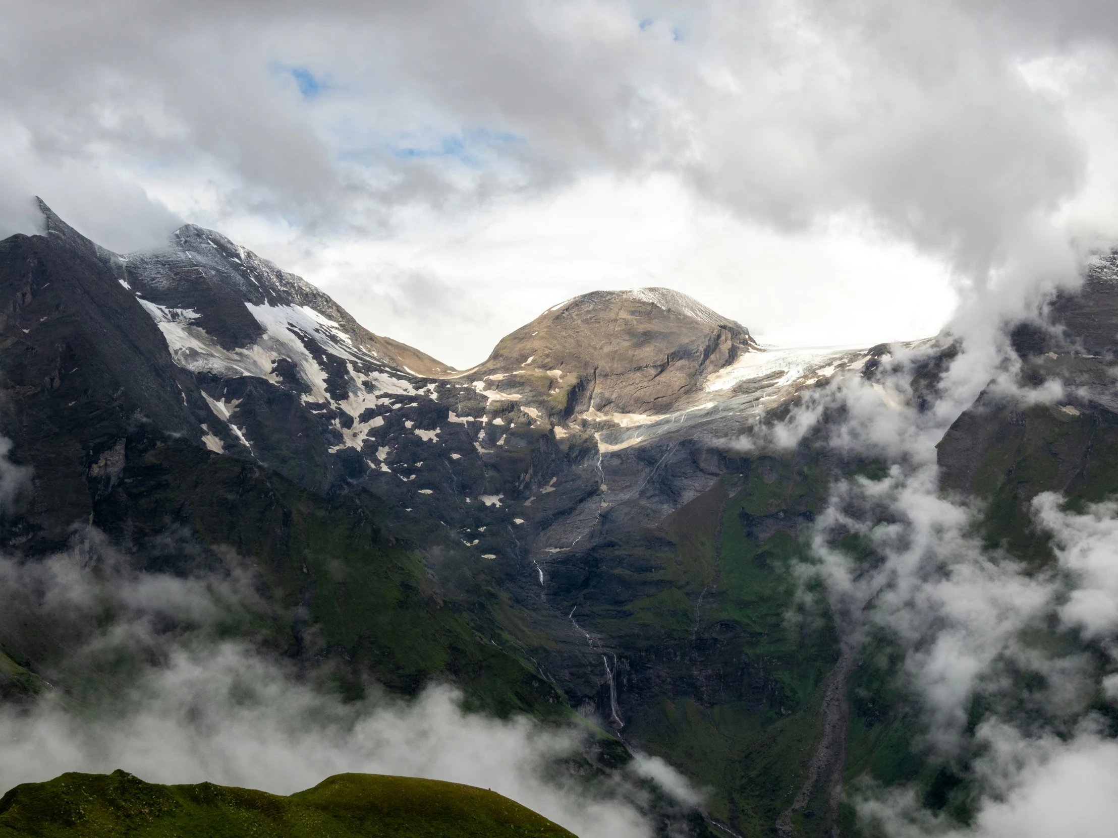 looking down the valley towards mountains covered with clouds