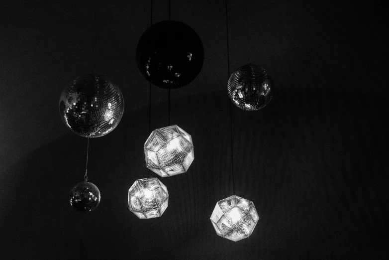 different lights on a ceiling in black and white