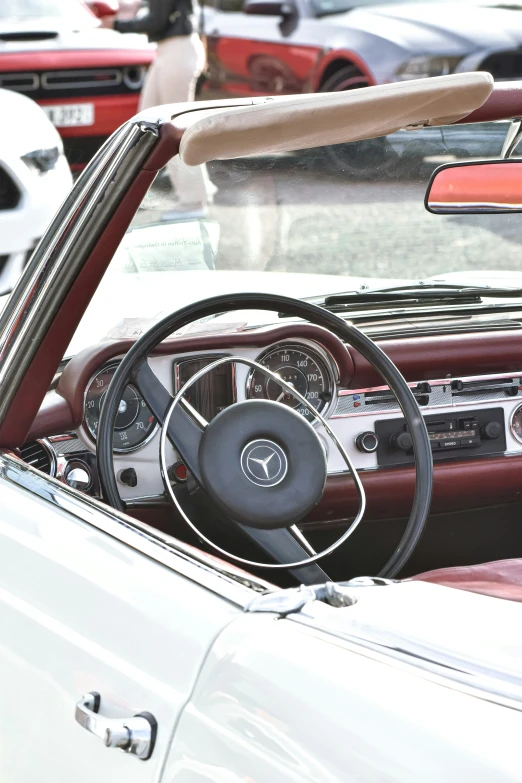 the inside of a classic car with steering wheel