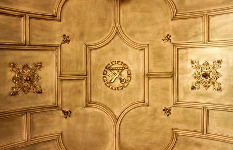 ceiling with gold color and clock on it