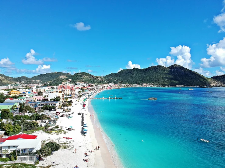 a beach and houses on an island in the ocean