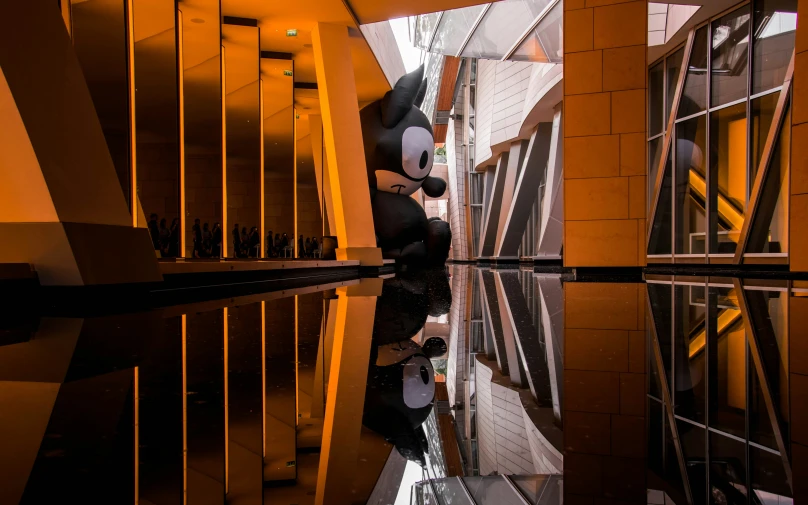 a reflection of a building is shown on the water