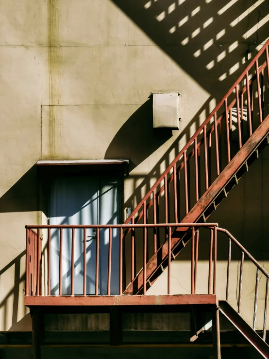 a staircase with a door next to a building