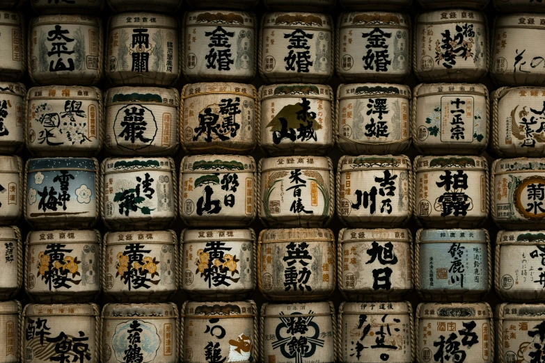 a bunch of sake barrels with asian characters on them