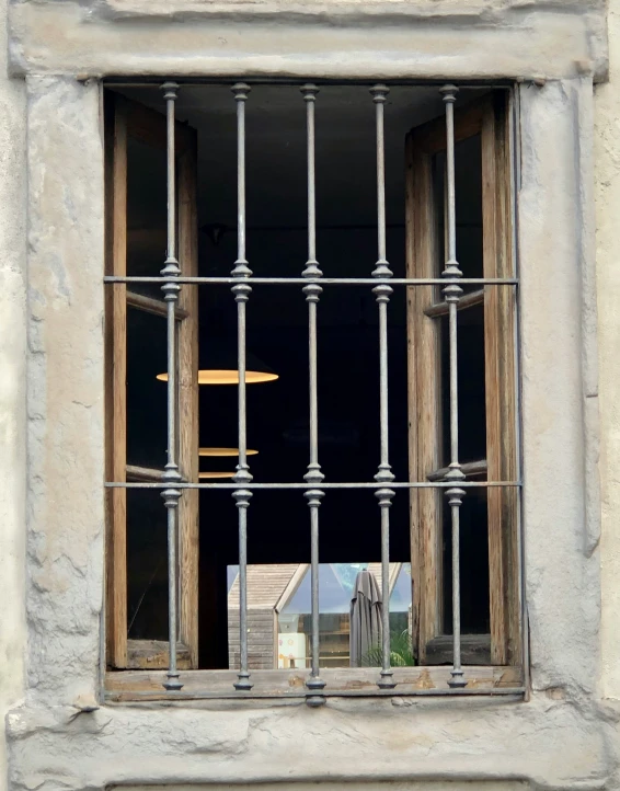 the window sill has bars for security