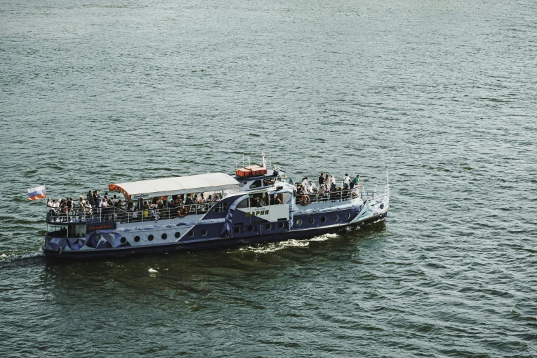 a very big boat full of people in the water