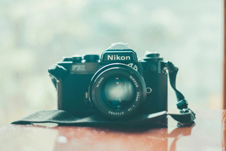 an old camera on top of a table