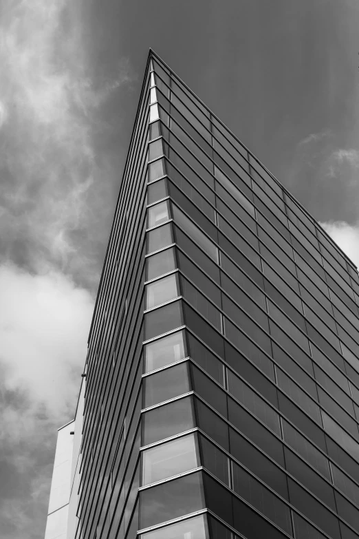 an upward s of a glass and stone building