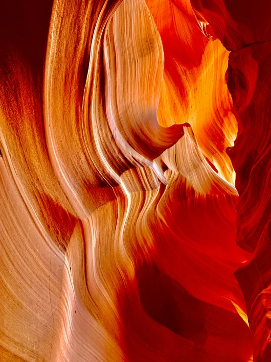 red, yellow and green layers of material in a canyon