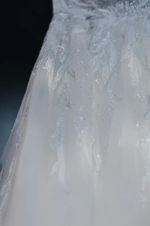 a white dress with some water droplets on it