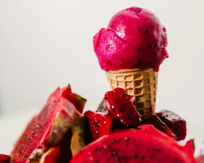 an ice cream cone with raspberry sorbret