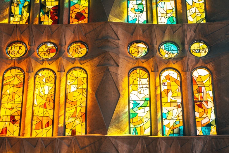 four large stain glass windows are shown here