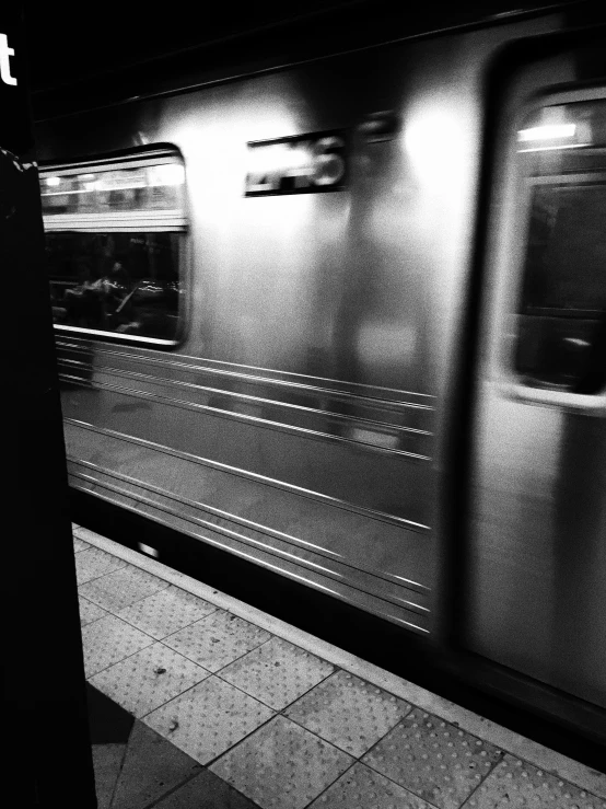 a subway with its windows opened at night