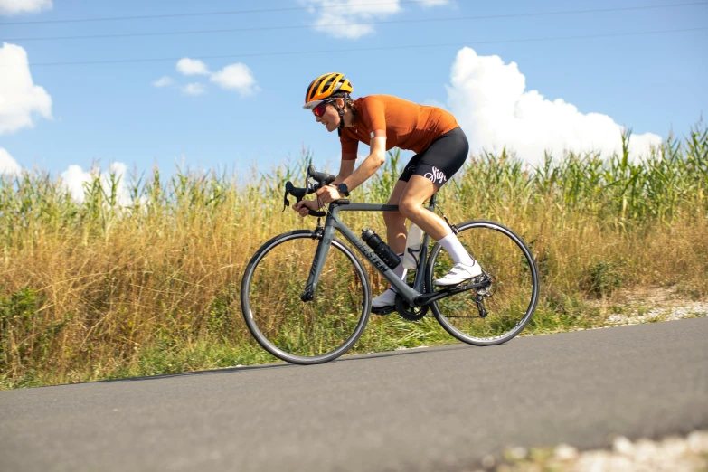 a man is biking in the middle of a road