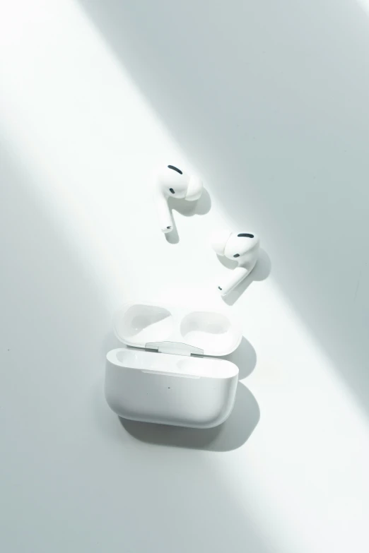 there are two pairs of earphones on a white background