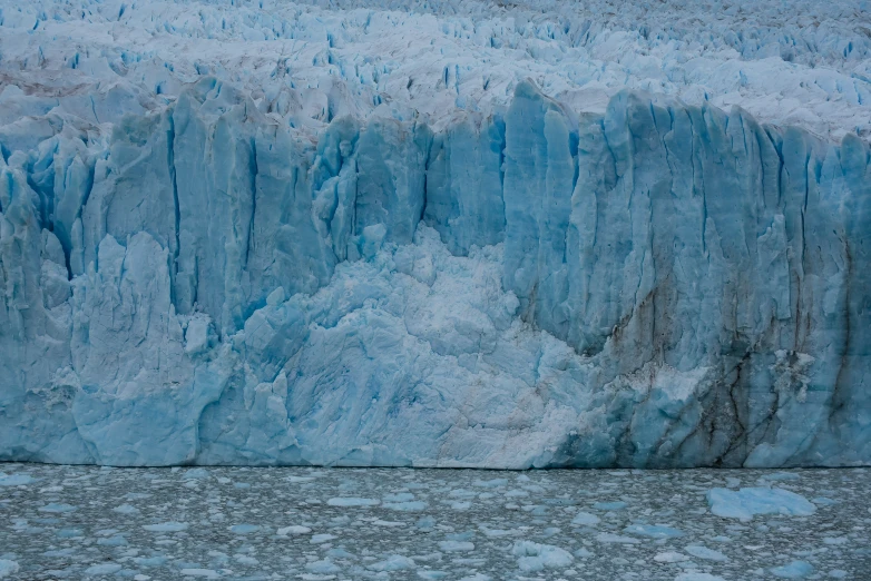 some very big blue and white ice on the ground